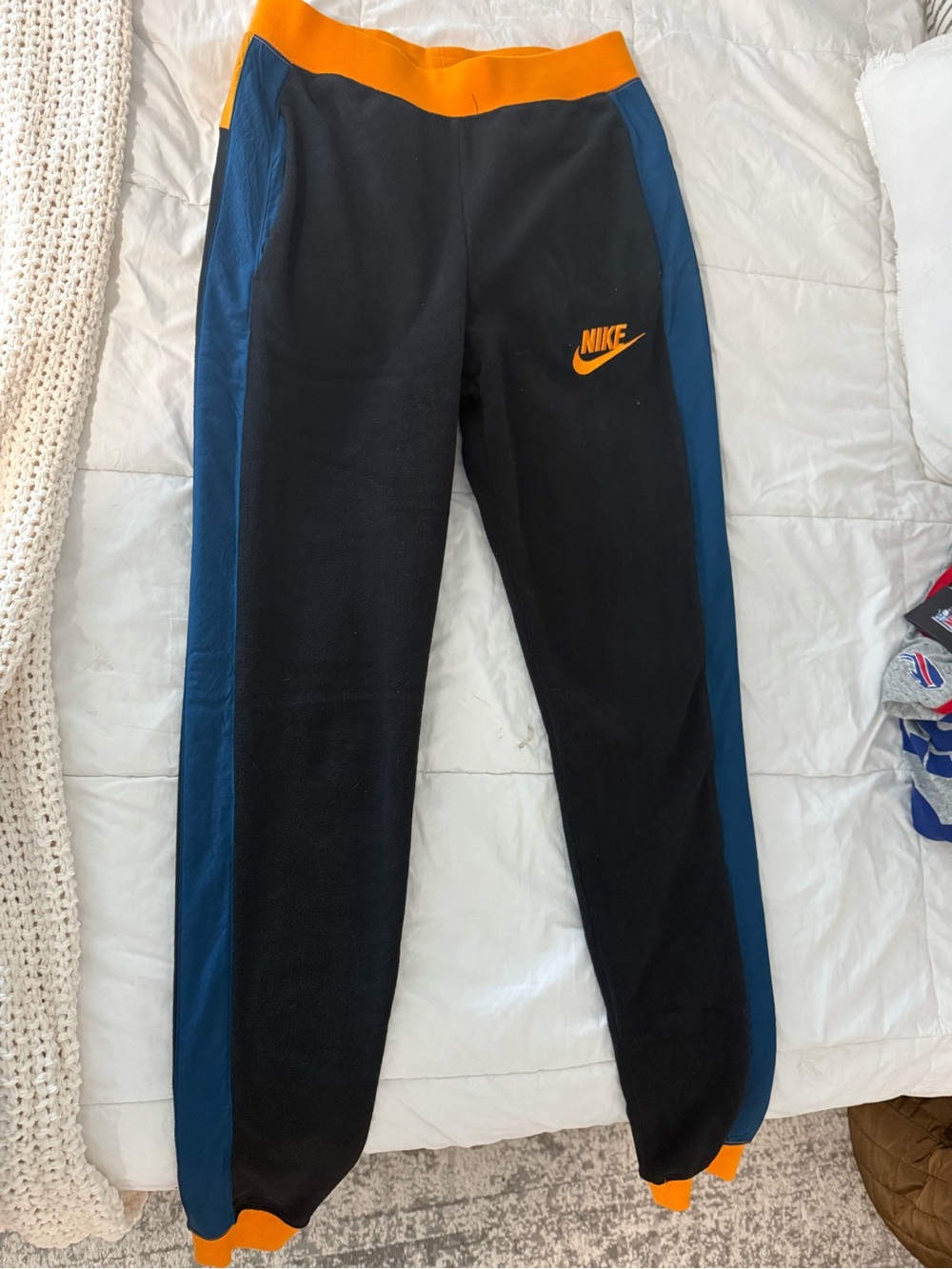 Nike Black Joggers with Blue Side Panels and Orange Accents